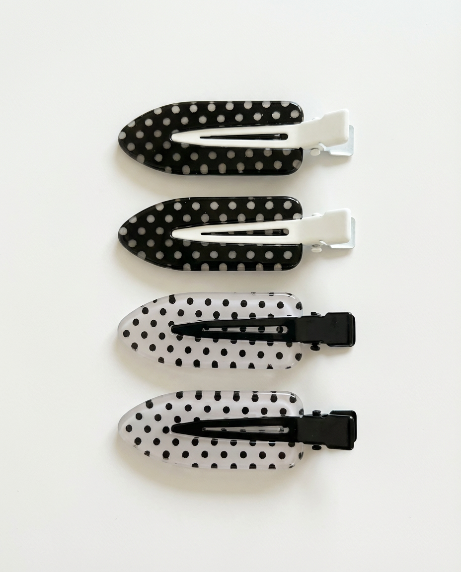 Care HairClips sektioneringsklemmer i sæt af fire, sort duckbill-design